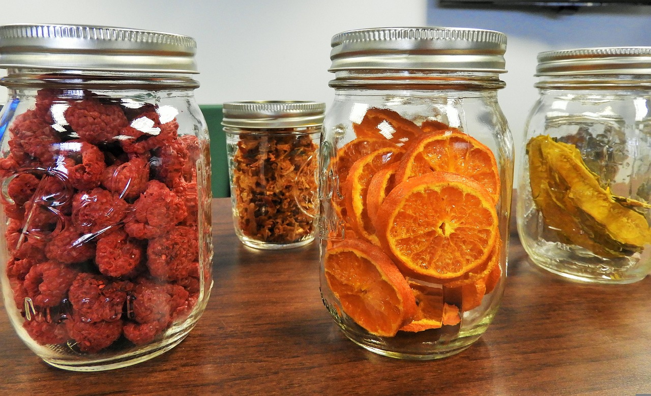 Pantry preserves and hermetic Mason jars with dehydrated fruit wheels and berries